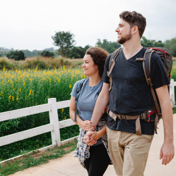 A couple taking a walk outside where allergens may be present